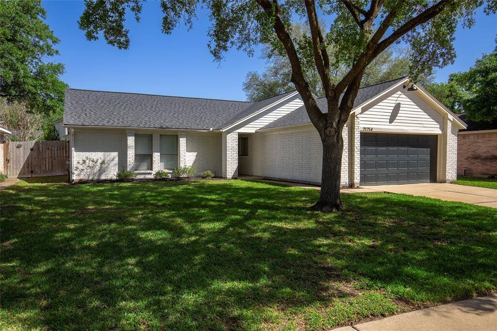 Welcome home to the new exterior, large mature shade tree, new landscaping and freshly planted grass.