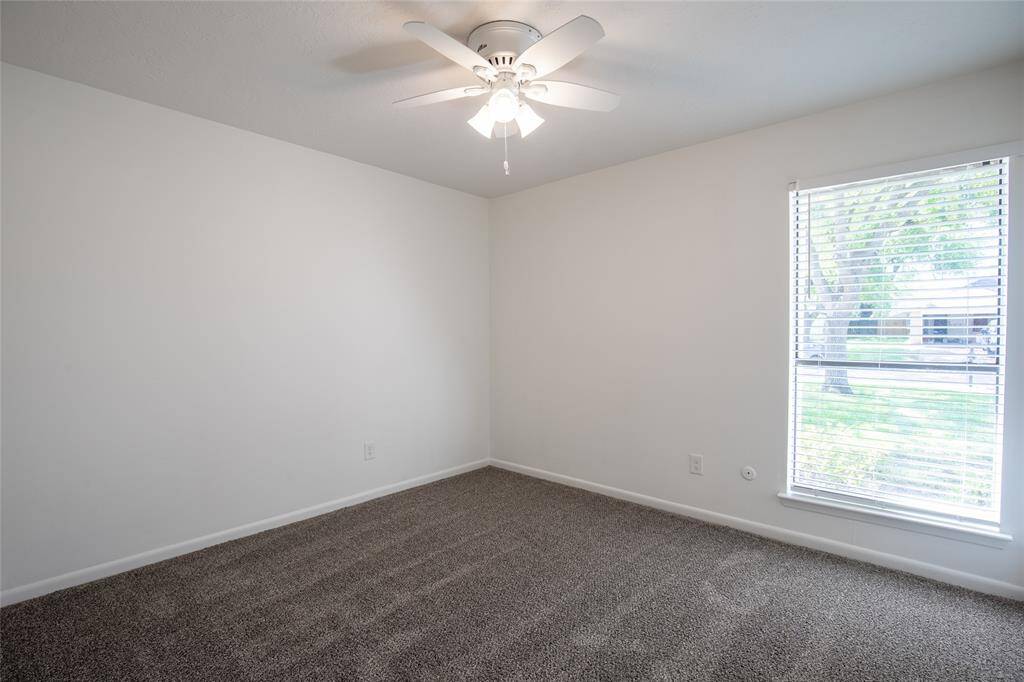 Large secondary bedrooms with new flooring and walk-in closets