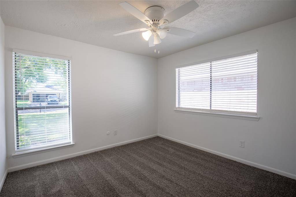 Lots of natural light to go with new flooring, blinds ceiling fans