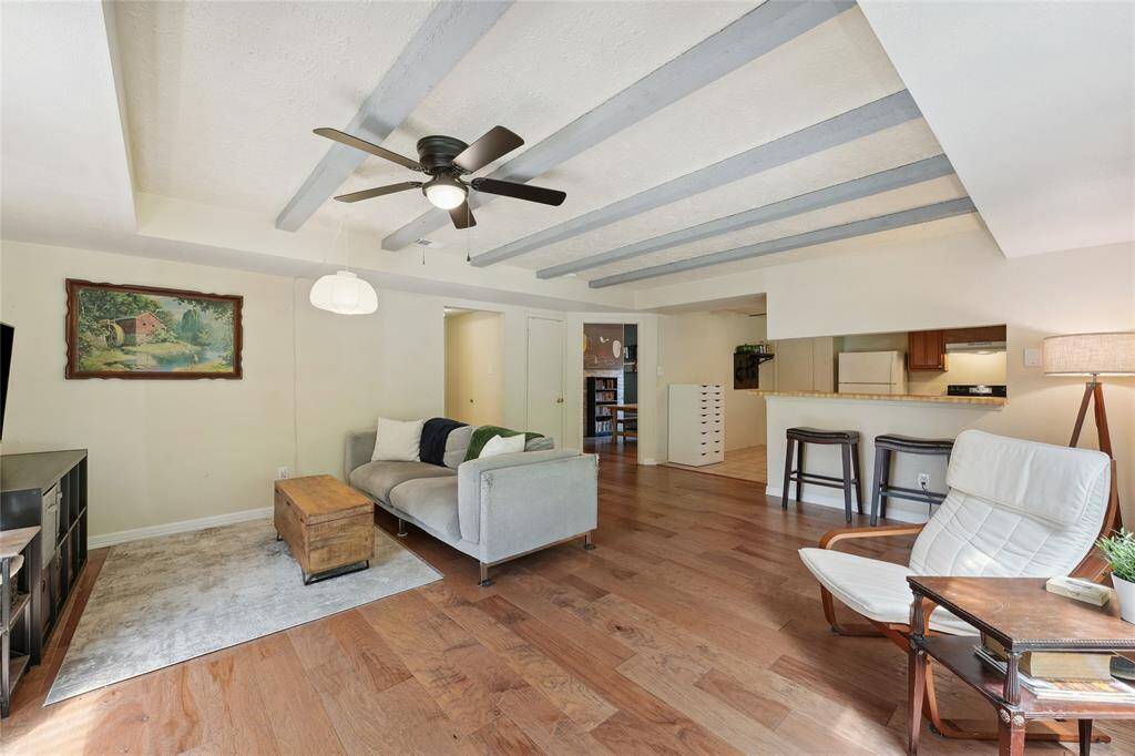 Another view of the dining room showcases the wood accent wall.