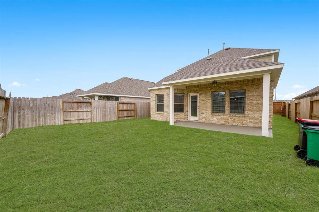 Check out all of that wonderful green space for the kids and pets to run around in, and a fantastic patio perfect for entertaining family, friends, and guests.