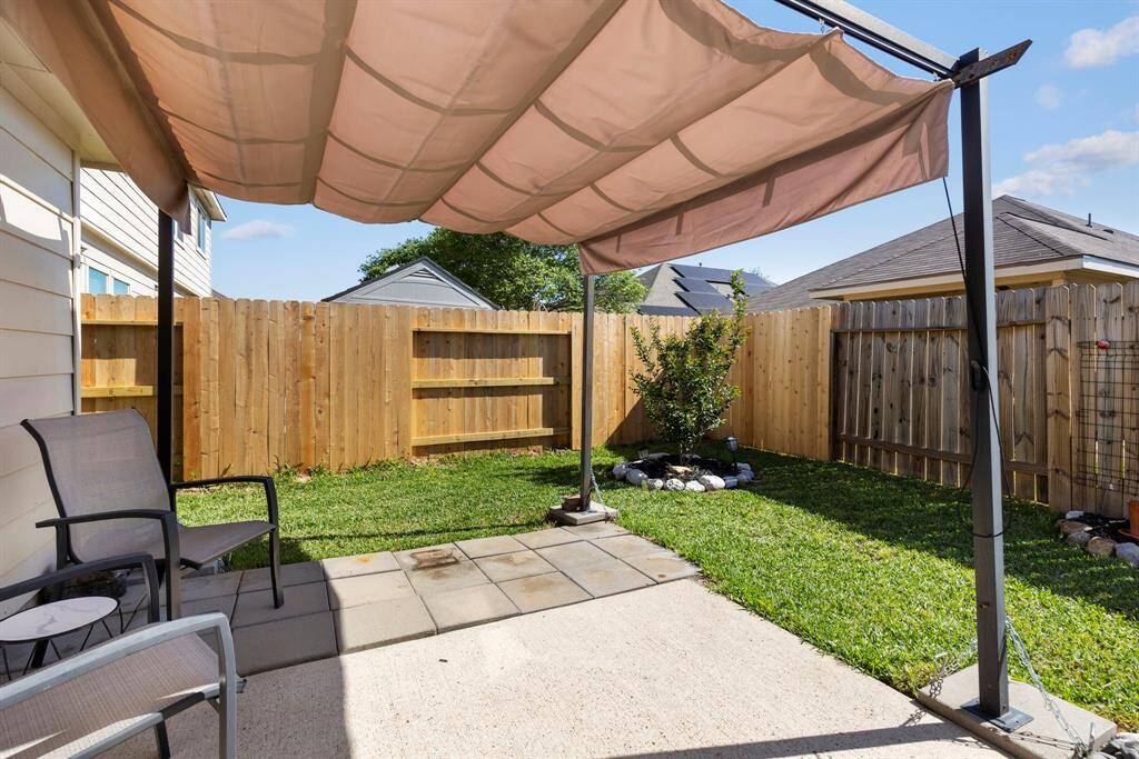 Backyard with new fencing and a good sized patio.