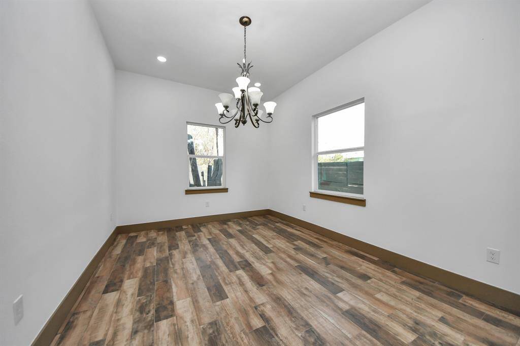 Dining room features two windows that let in natural light
