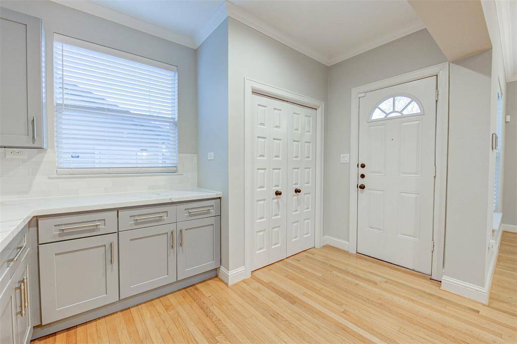 Exterior door from the kitchen leads to the back yard and garage