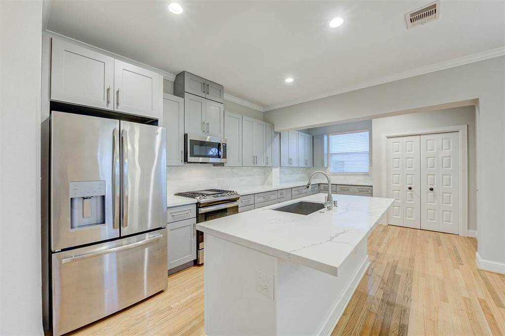 Open kitchen with refrigerator included