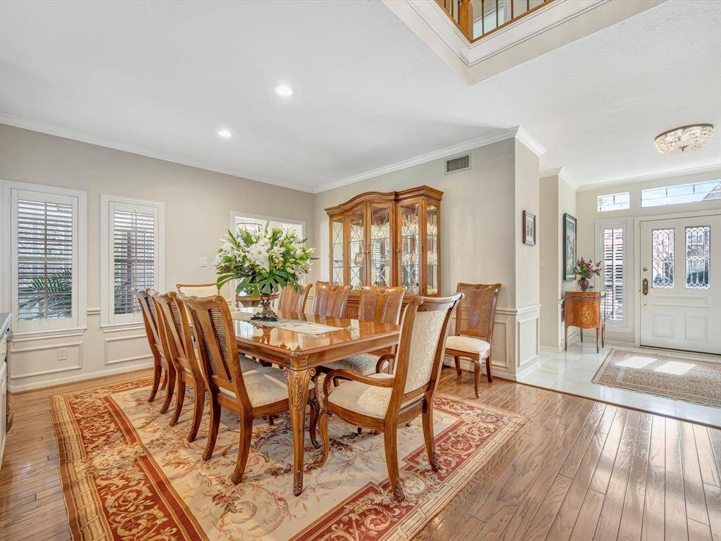 Formal dining offers wood floors, wet bar and wine fridge