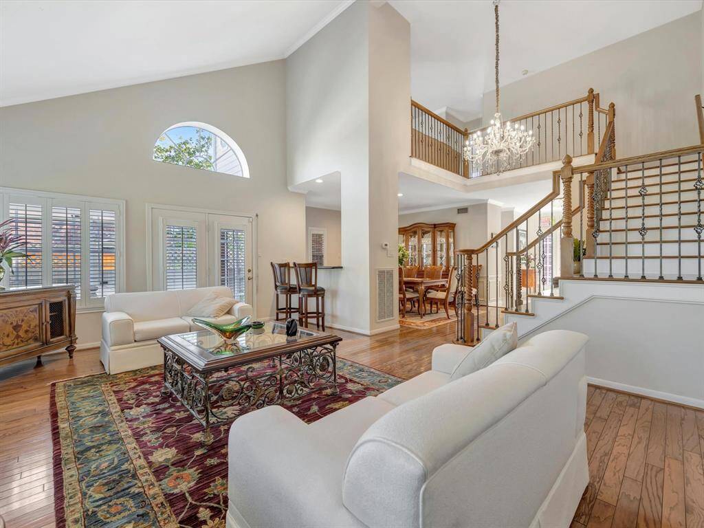 Family room open to dining room for entertaining, note the wet bar over looking dining room, french doors go to back patio