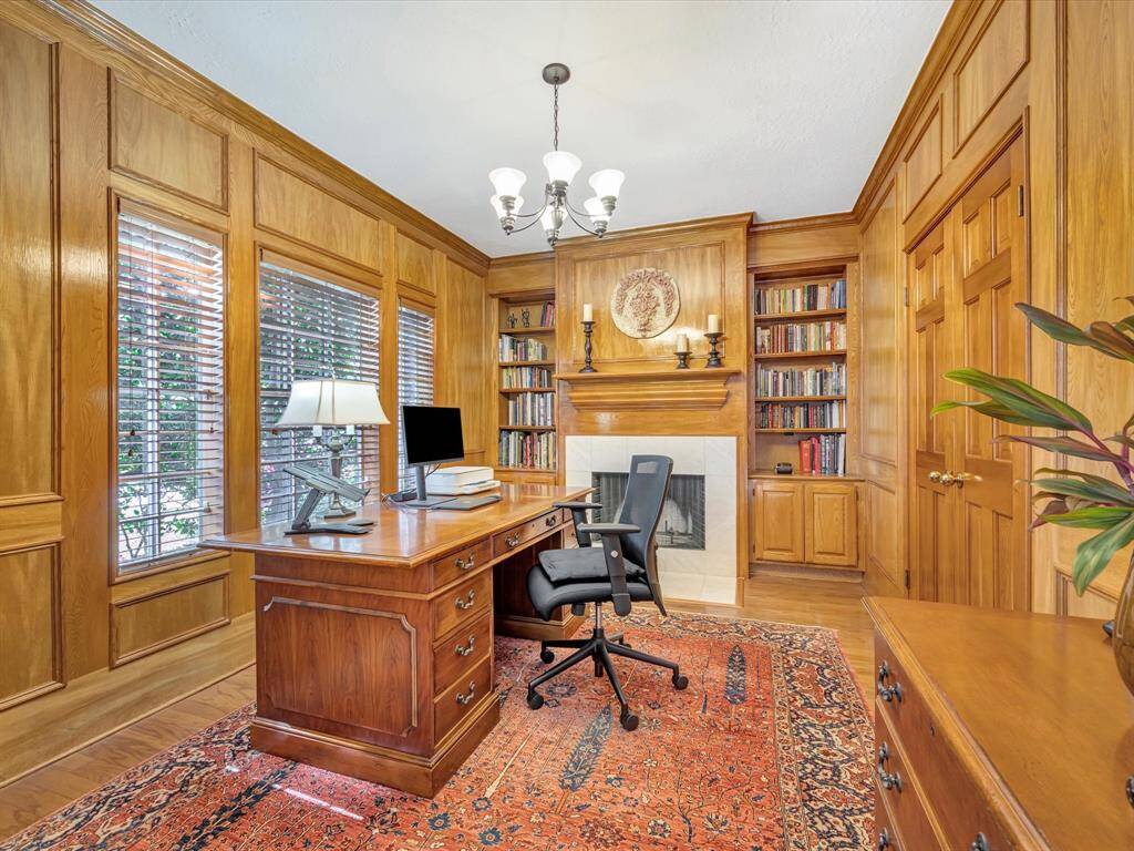 Study/office/library view from entrance, note the 2nd fireplace, french doors to right connect to primary bedroom