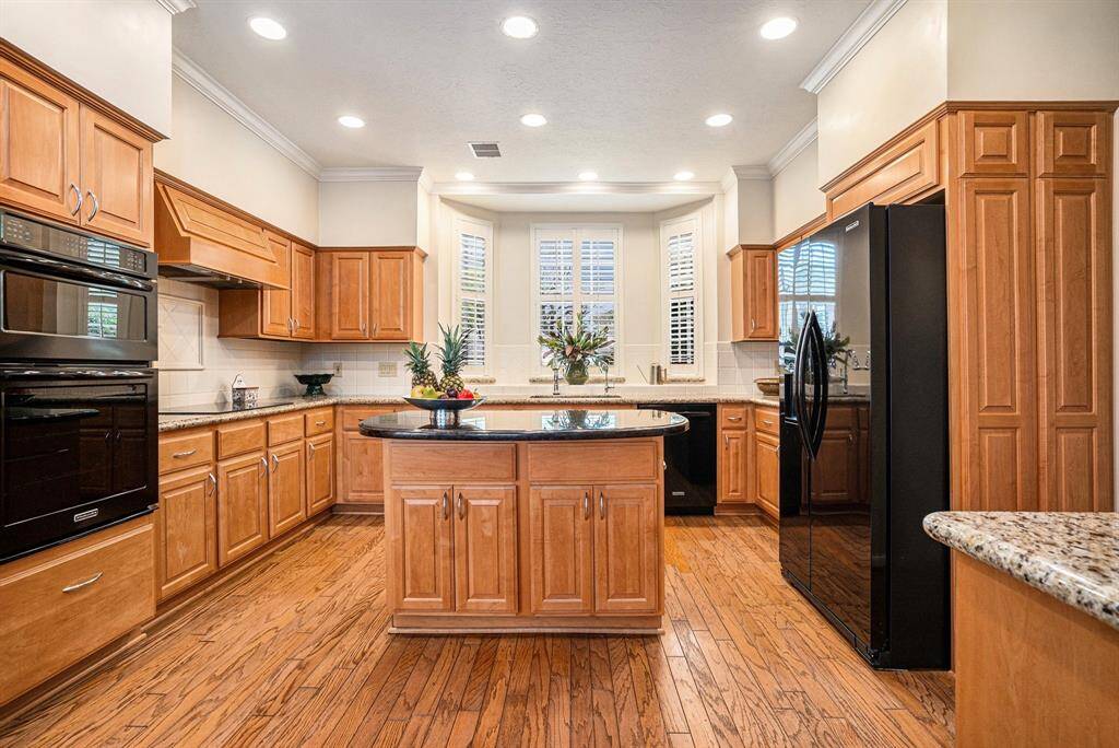 Upgraded kitchen offers all Kitchen Aid appliances, soft close pullout drawers and cabinets for ease of organized storage. Refrigerator will stay.