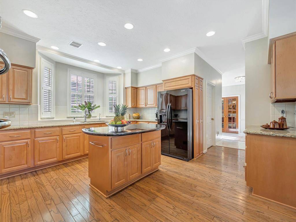 Another view of kitchen from breakfast area. Note butlers pantry on right.
