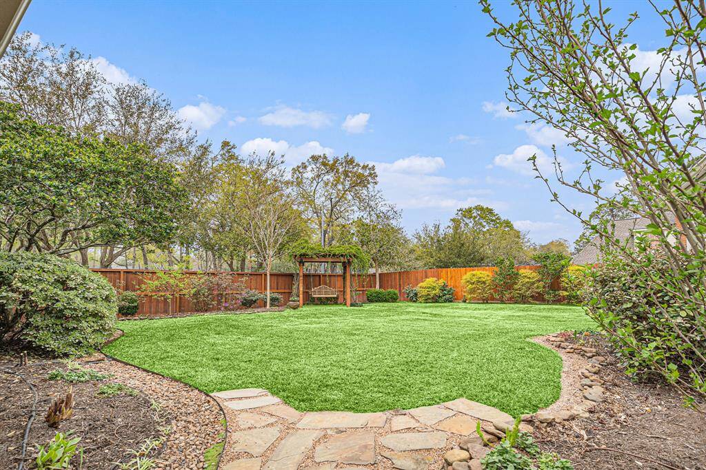 View of back yard and arbor from breezeway