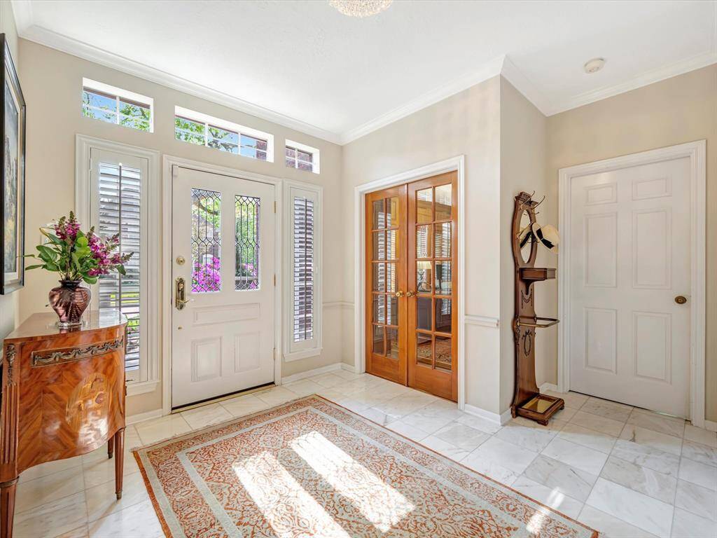 Formal inside entrance, French doors to warm cozy study/office