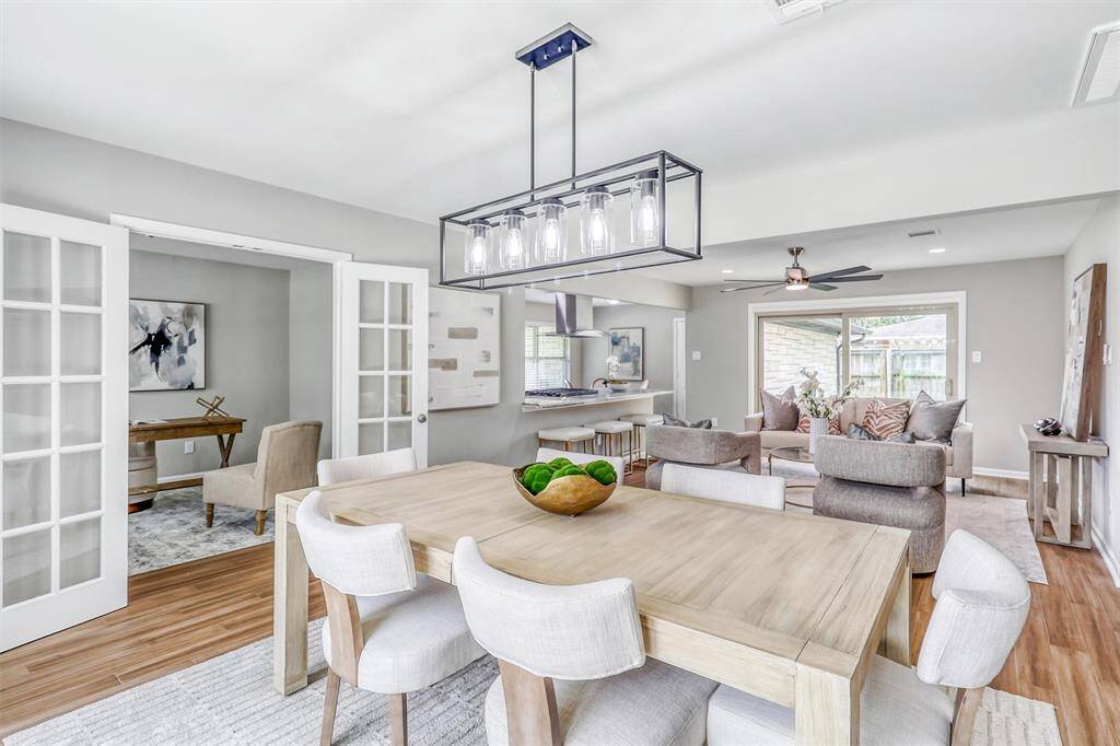 French doors open to a private study, while the dining room remains connected to the kitchen and family room—balancing formality with everyday function.