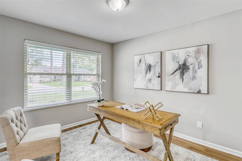 Large windows bathe the space in natural light while providing a view of the front yard, making it easy to stay inspired throughout the day.