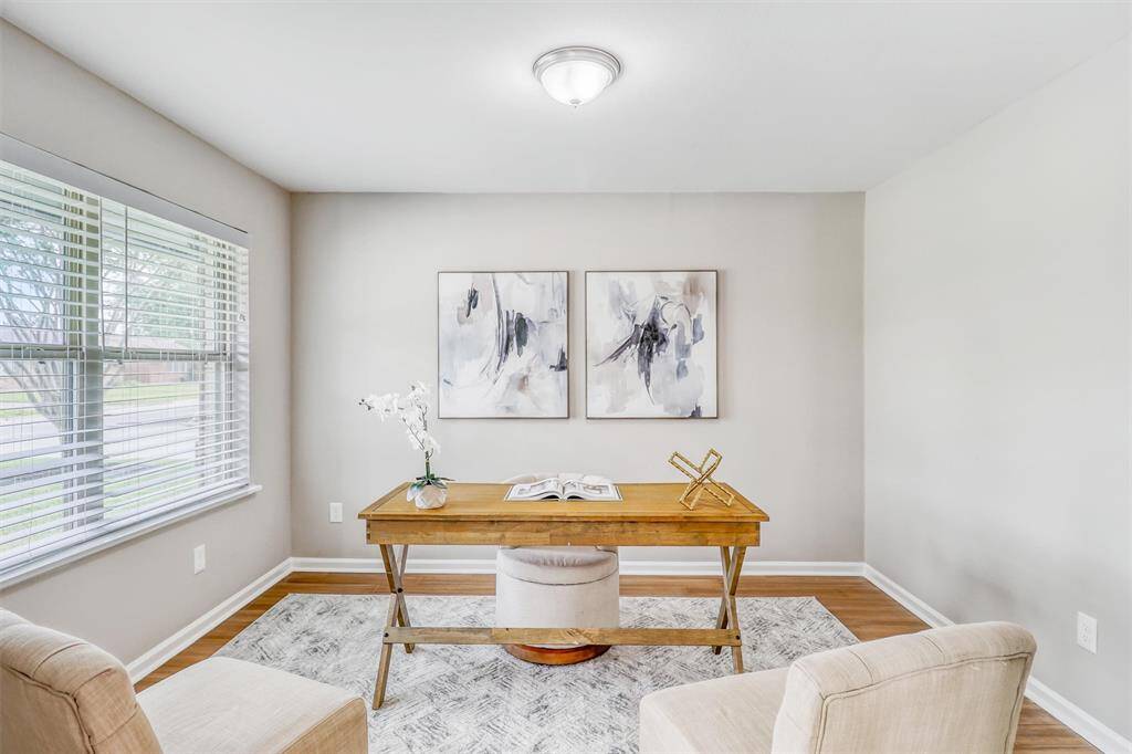 With neutral tones, durable flooring, and a spacious layout, this room is ready to serve as a home office, hobby space, or otherwise.