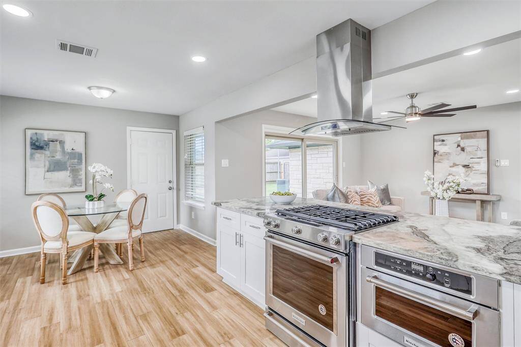 Tucked in a sunny corner just off the kitchen, the breakfast space adds warmth and versatility to the open-concept floorplan.