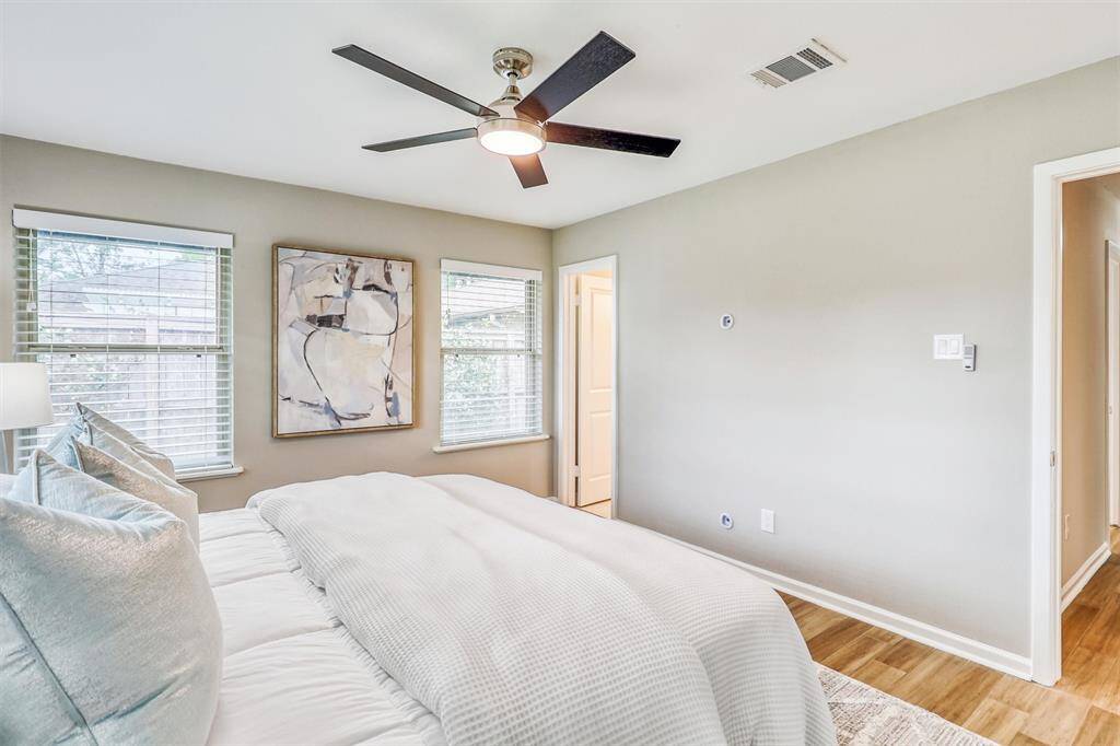 With peaceful views and direct access to the ensuite bath, this inviting space blends comfort and functionality.