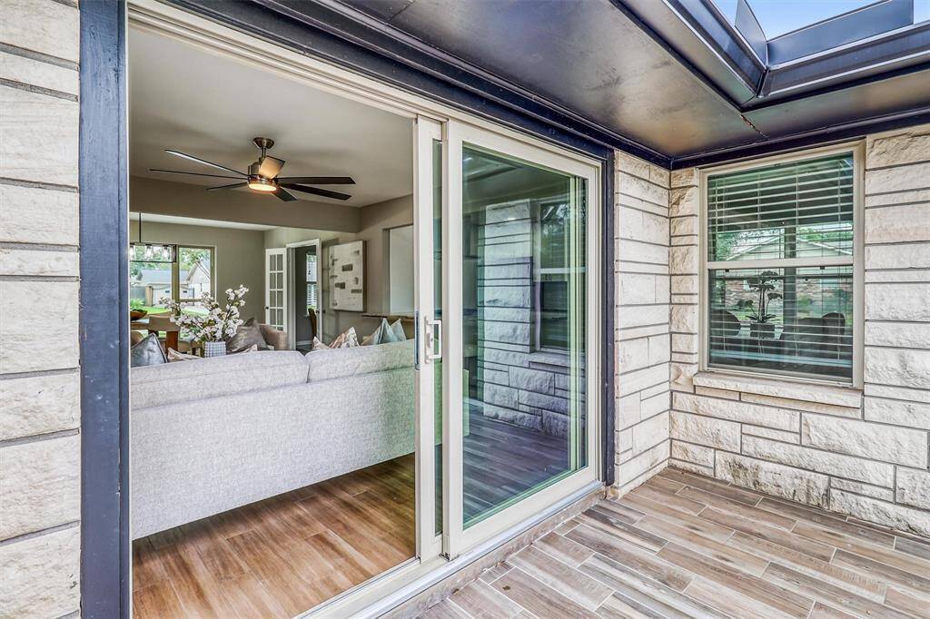Enjoy seamless indoor-outdoor living with large sliding doors that open to the extended patio—perfect for relaxing or entertaining.
