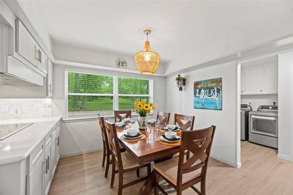 The dining area, conveniently located next to the kitchen and living room, offers plenty of space for a large table—perfect for family meals and gatherings!