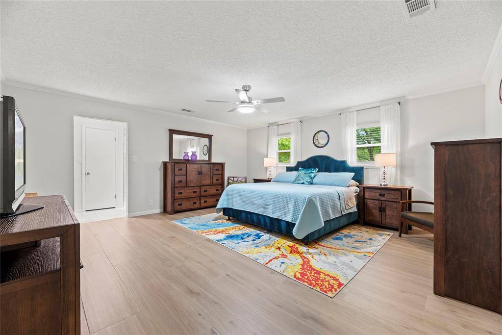 How perfect is this primary suite? Spacious and filled with natural light, this serene retreat offers the ultimate escape, promising comfort, tranquility, and pure relaxation.