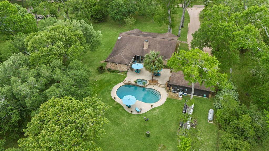 From an aerial perspective at the back of the home, you'll truly appreciate its beauty and elegance. This residence is a stunning testament to what a perfect home can be, offering everything a family could desire and more.