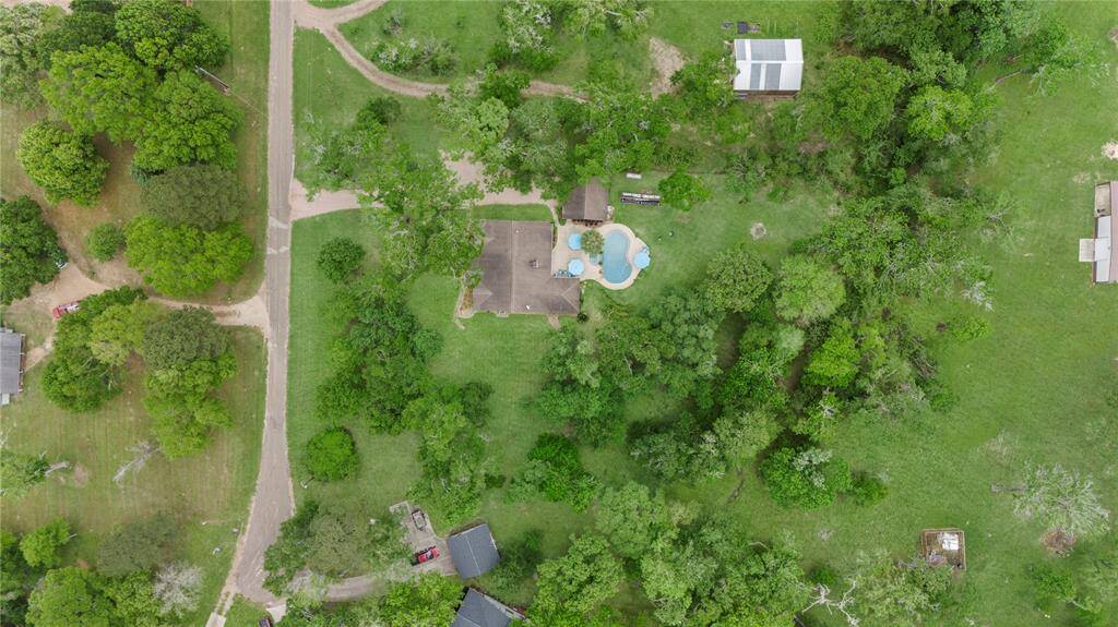 This impressive aerial view showcases the prime location of this lot, perfectly positioned within the wooded and scenic community.
