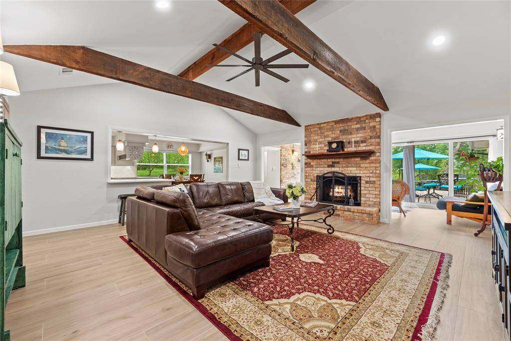 This chic living room space has a great feel with tons of natural light coming from all of the windows.