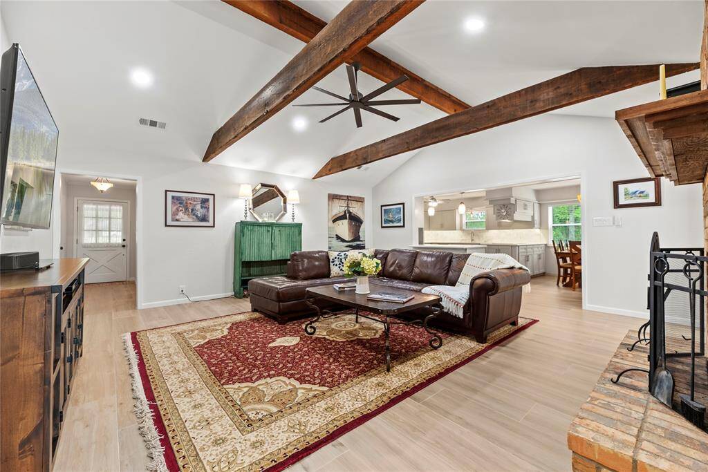 The exposed beams create a dramatic focal point that complements the overall aesthetic.