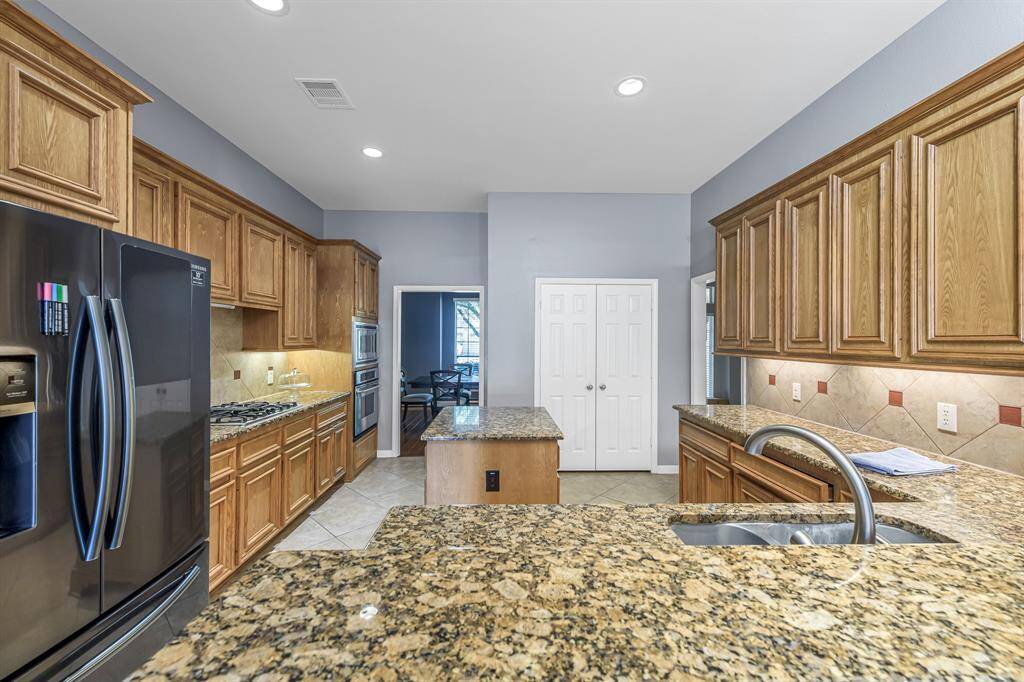 Amazing kitchen offers tons of granite counter space and cabinets