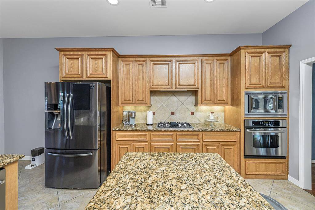 Built in microwave and oven and gas cooktop are sure to please the chef in the family