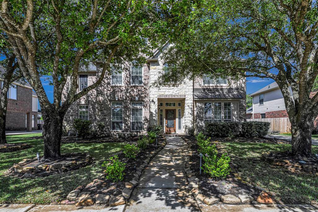 Welcome to 2226 Arrowwood Trail, as you approach the home you're greeted by a canopy of mature trees that arch gently over the front walkway