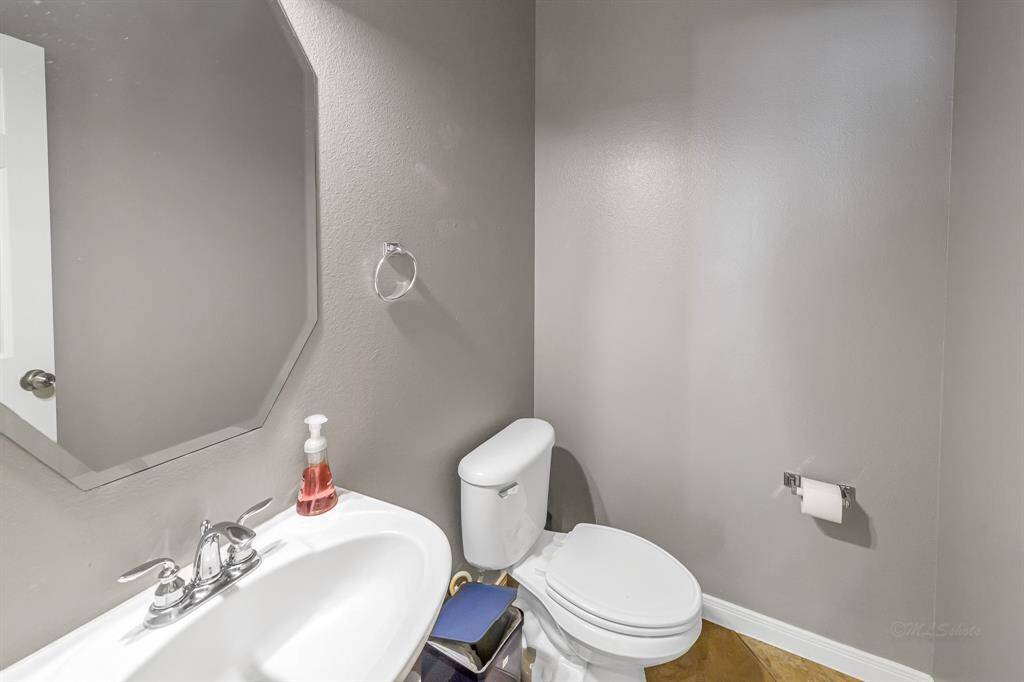 Half bath off is ideally located off the family room, easy access for your guests