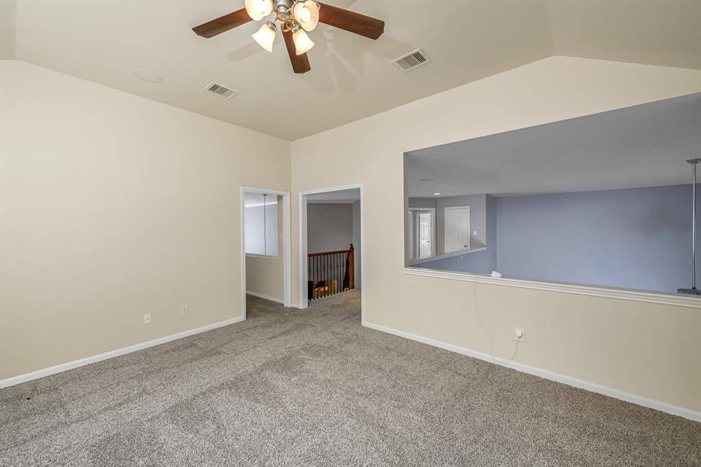 Another view of the upstairs gameroom which over looks the family room