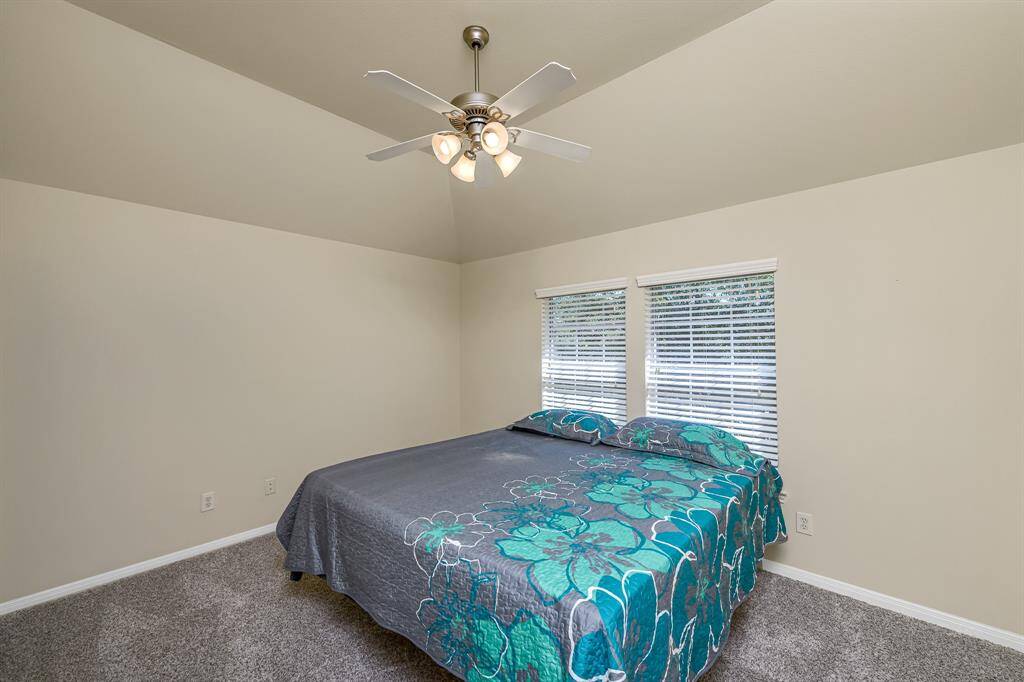 One of the spacious secondary bedrooms upstairs, this would be a perfect guest room as there is a full bath just outside the door