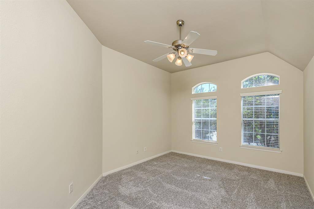 Bedroom #3 with large windows and ceiling fan