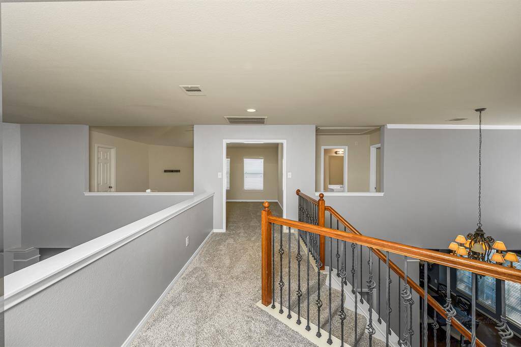 Landing at the top of the stair facing the game room