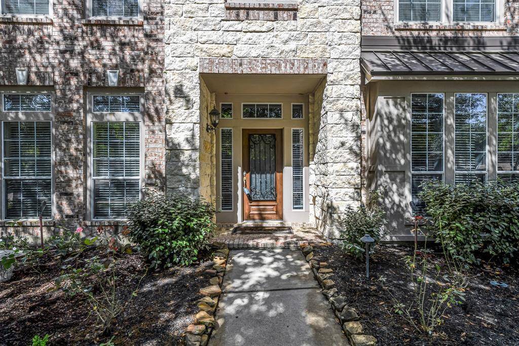 Your new home awaits just beyond this beautiful lead glass and wrought iron front door