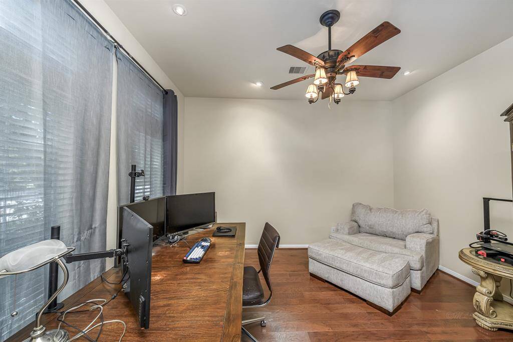 To the left of the front door is a flex space, currently being used as a study
