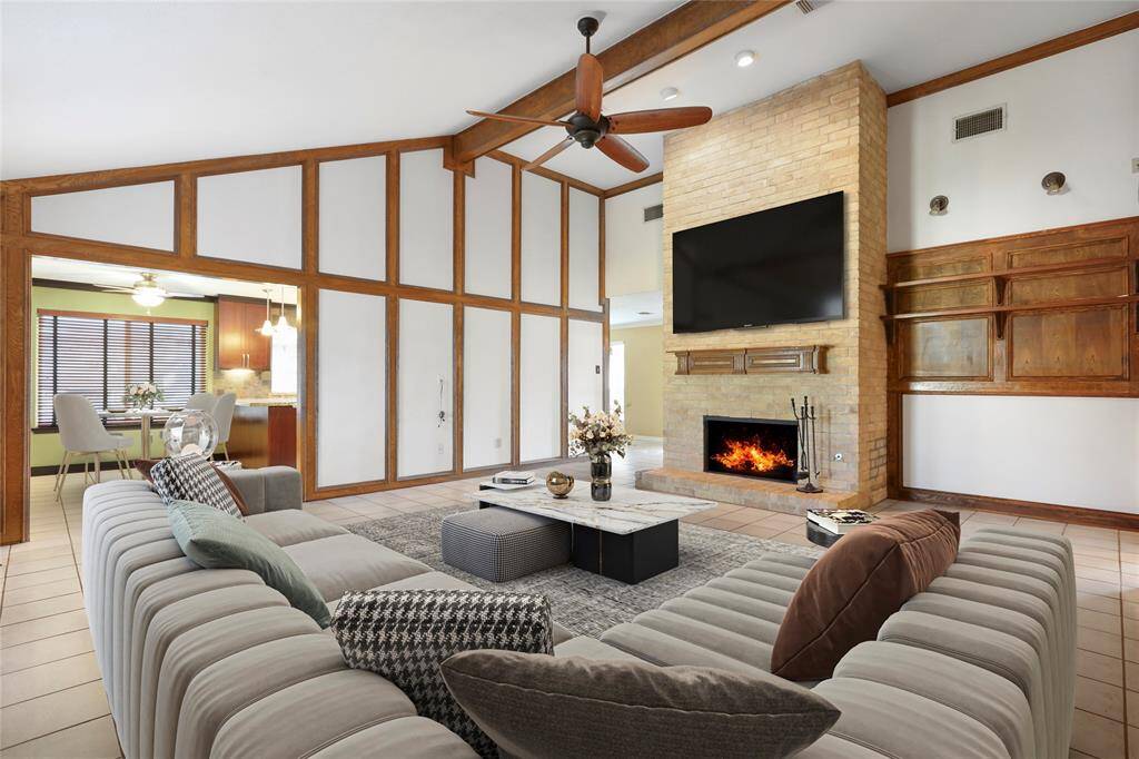 Private home office with french doors, brick accent wall and views of the beautiful front yard. (Photo virtually staged)