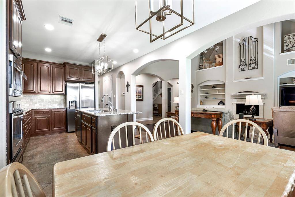 From the breakfast room, you’ll notice the arched doorways that enhance the open, airy feel while still providing designated spaces for each area of the home.