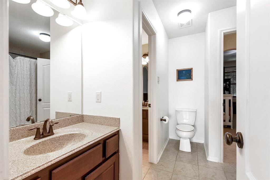 Upstairs features a shared, Hollywood-style bathroom connecting two of the three guest bedrooms. Each room has its own private vanity, with a shared two-piece bath in between—offering both privacy and convenience for guests.