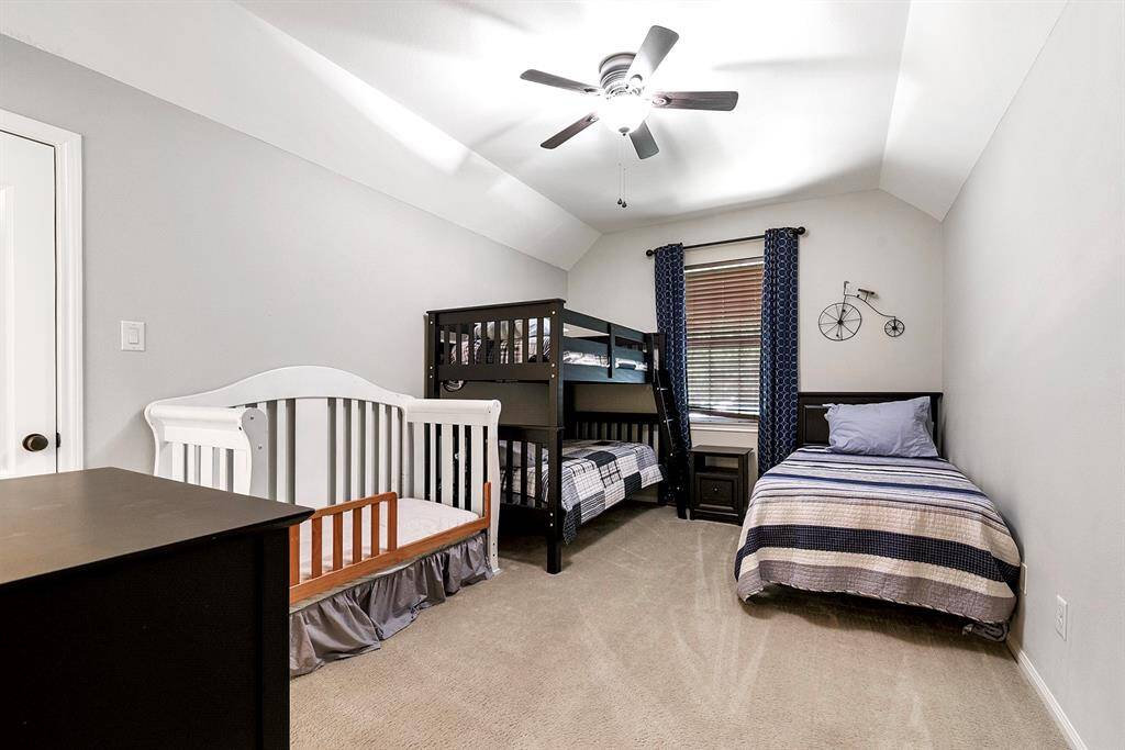 Upstairs features three spacious guest bedrooms, each with ample room to comfortably fit multiple beds and additional furniture.
