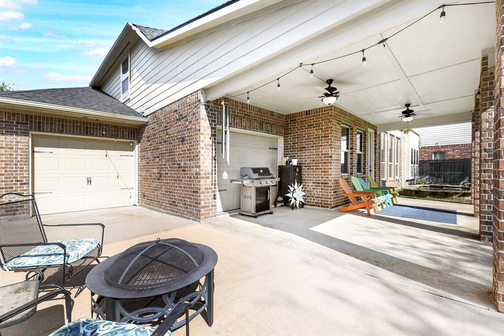 Take a closer look at the oversized extended patio and covered area—perfectly designed for gatherings of any size. With dual ceiling fans, comfort is guaranteed year-round, making it an ideal space for outdoor entertaining. Plus, a charming koi pond adds a tranquil touch to the backyard oasis.