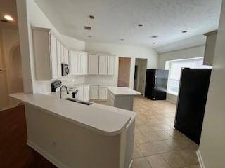 Large kitchen with island and bar