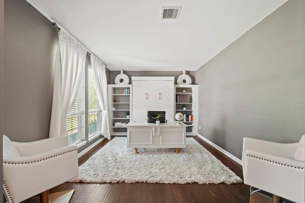 Designed with both function and aesthetics in mind, this private office includes built-in shelving and plenty of space for your dream desk setup—perfect for remote work or quiet study.