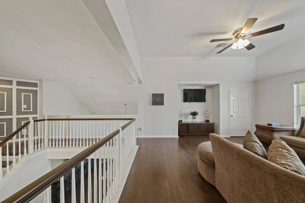 Overlooking the main living area, the expansive game room offers a flexible space for movie nights, gaming, or relaxing with family.
