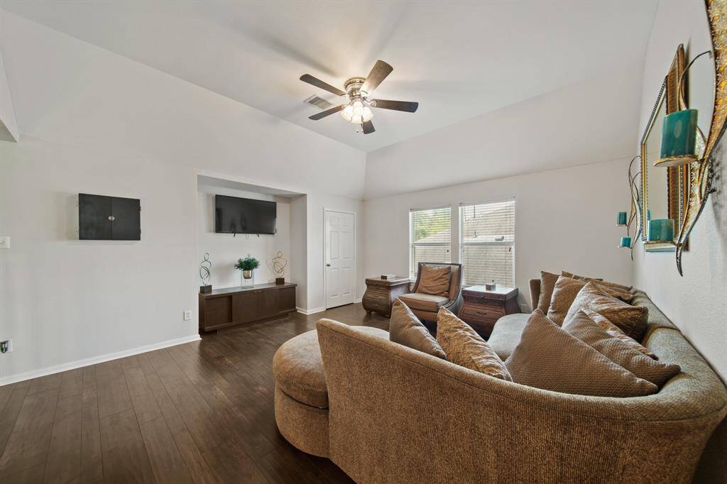 From cozy evenings to casual gatherings, this game room delivers comfort and style with a ceiling fan, built-in media nook, and welcoming atmosphere.
