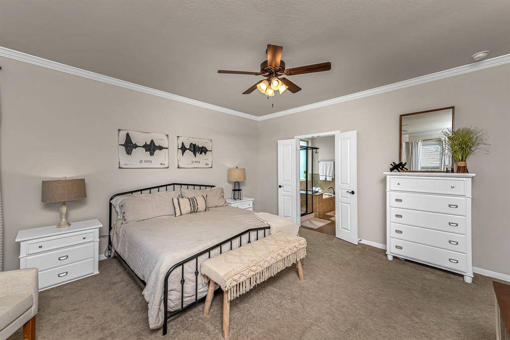 Another view of the primary bedroom