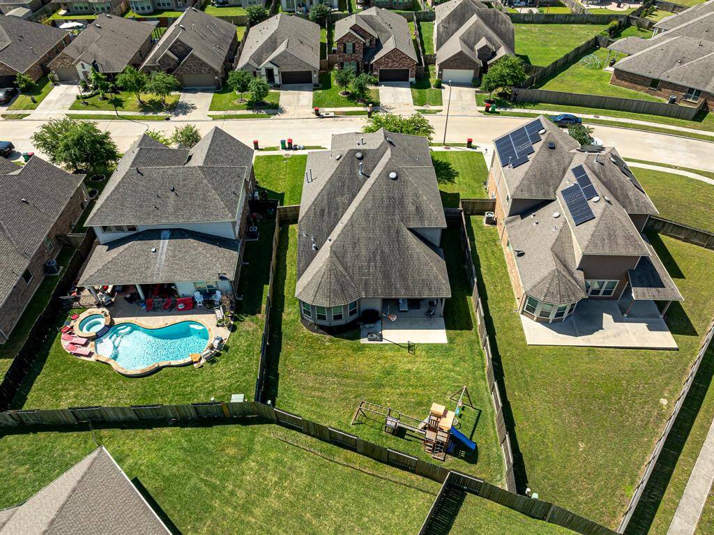 This gorgeous home sits on an oversized lot with brick and stone front elevation