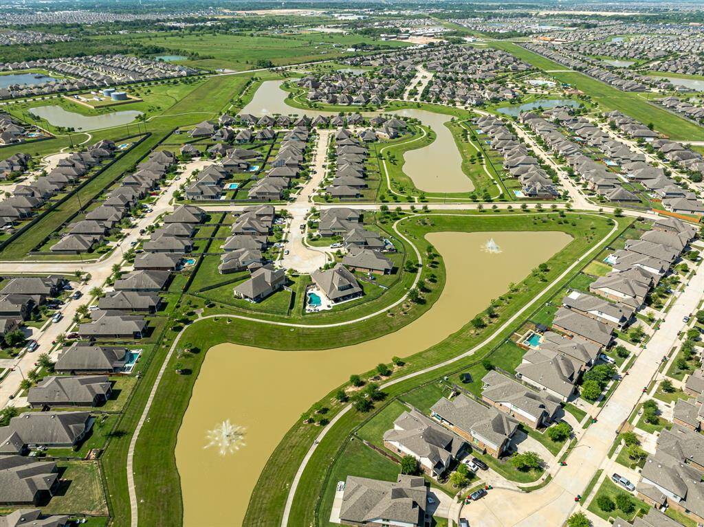 The home is just steps from the lakes and walking trails